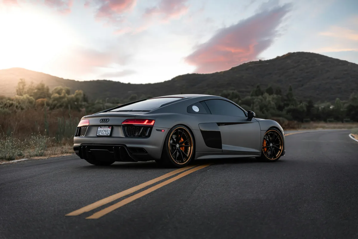Matte grey Audi R8 photographed outdoors before studio compositing
