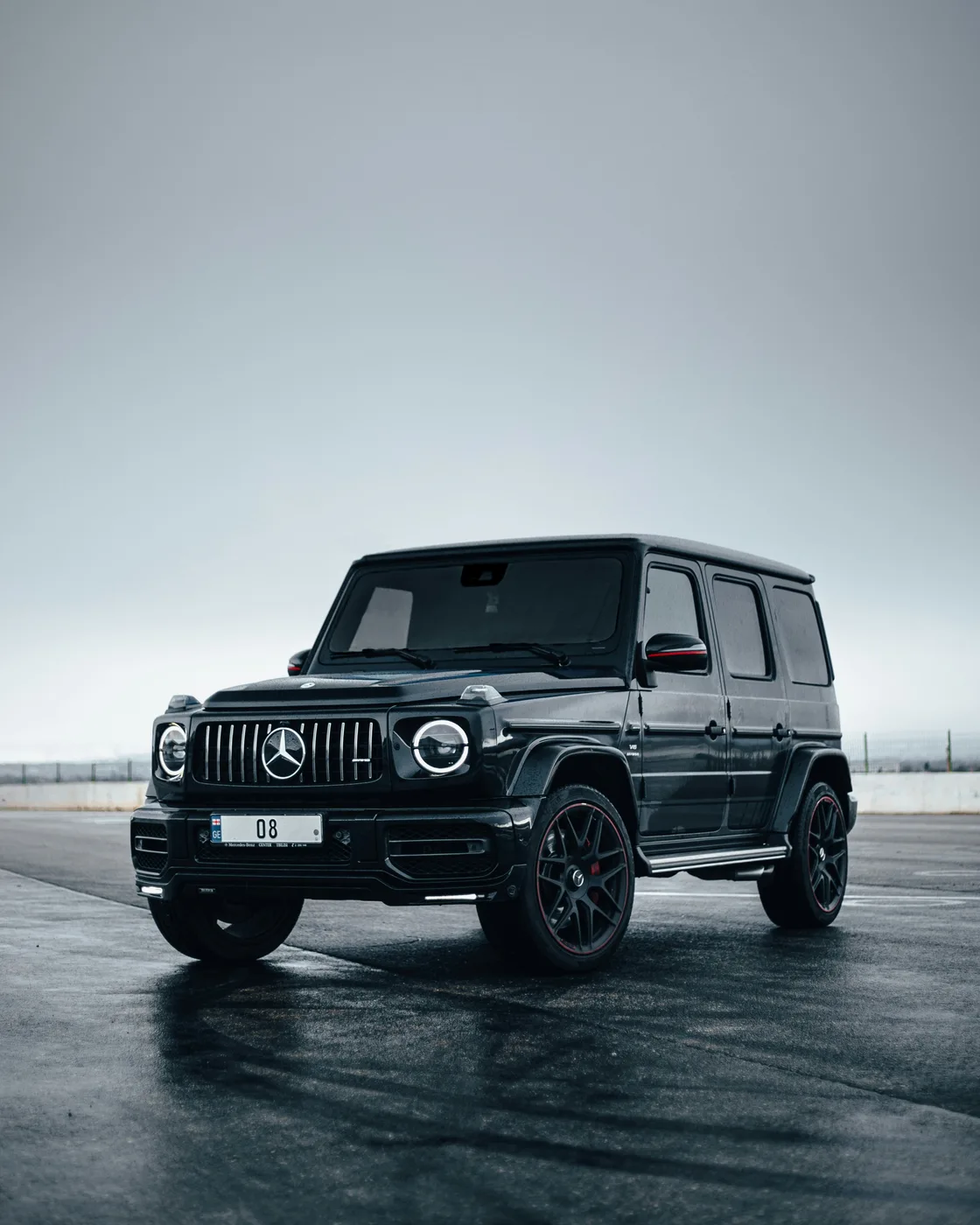 Black Mercedes-Benz G-Class photographed outdoors before studio compositing